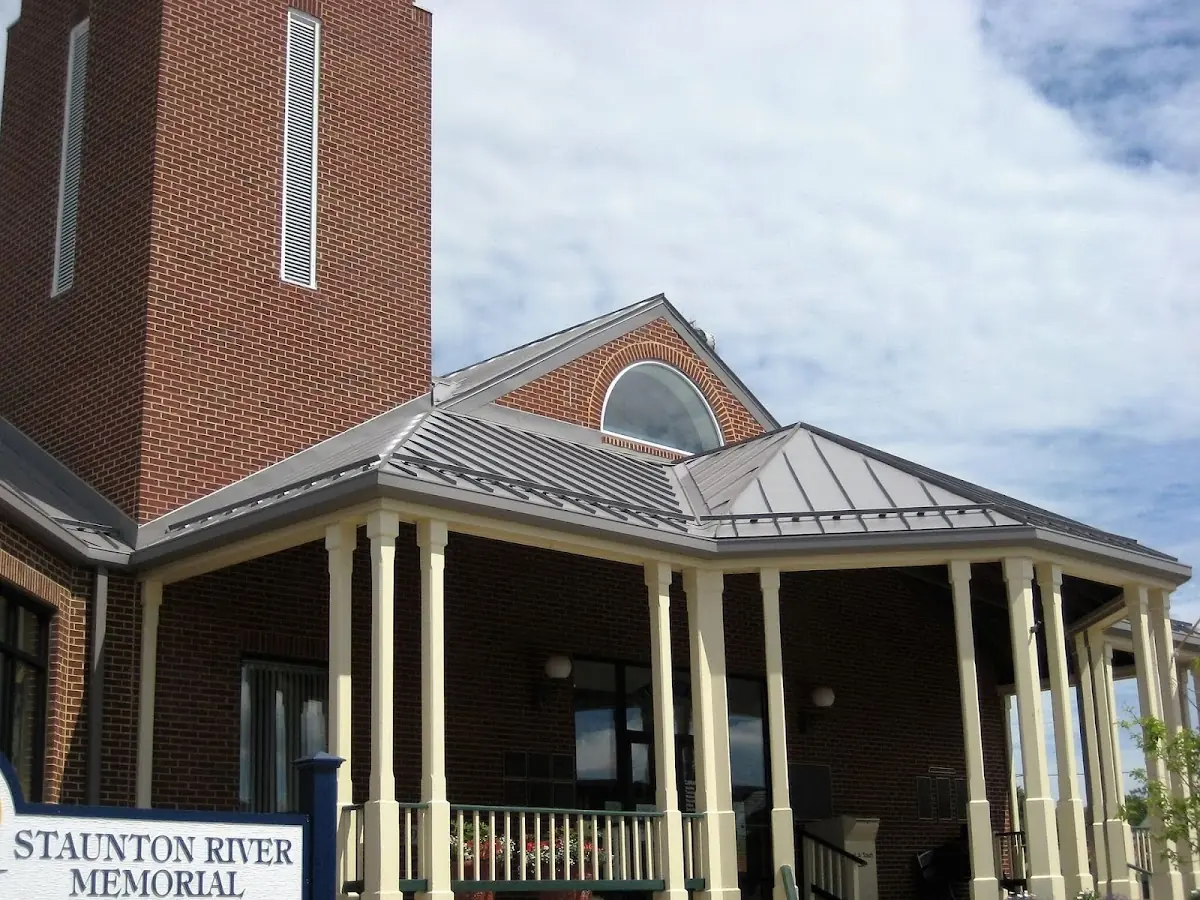 Skilled roofing craftsmen working on a residential roof in Fort Stewart